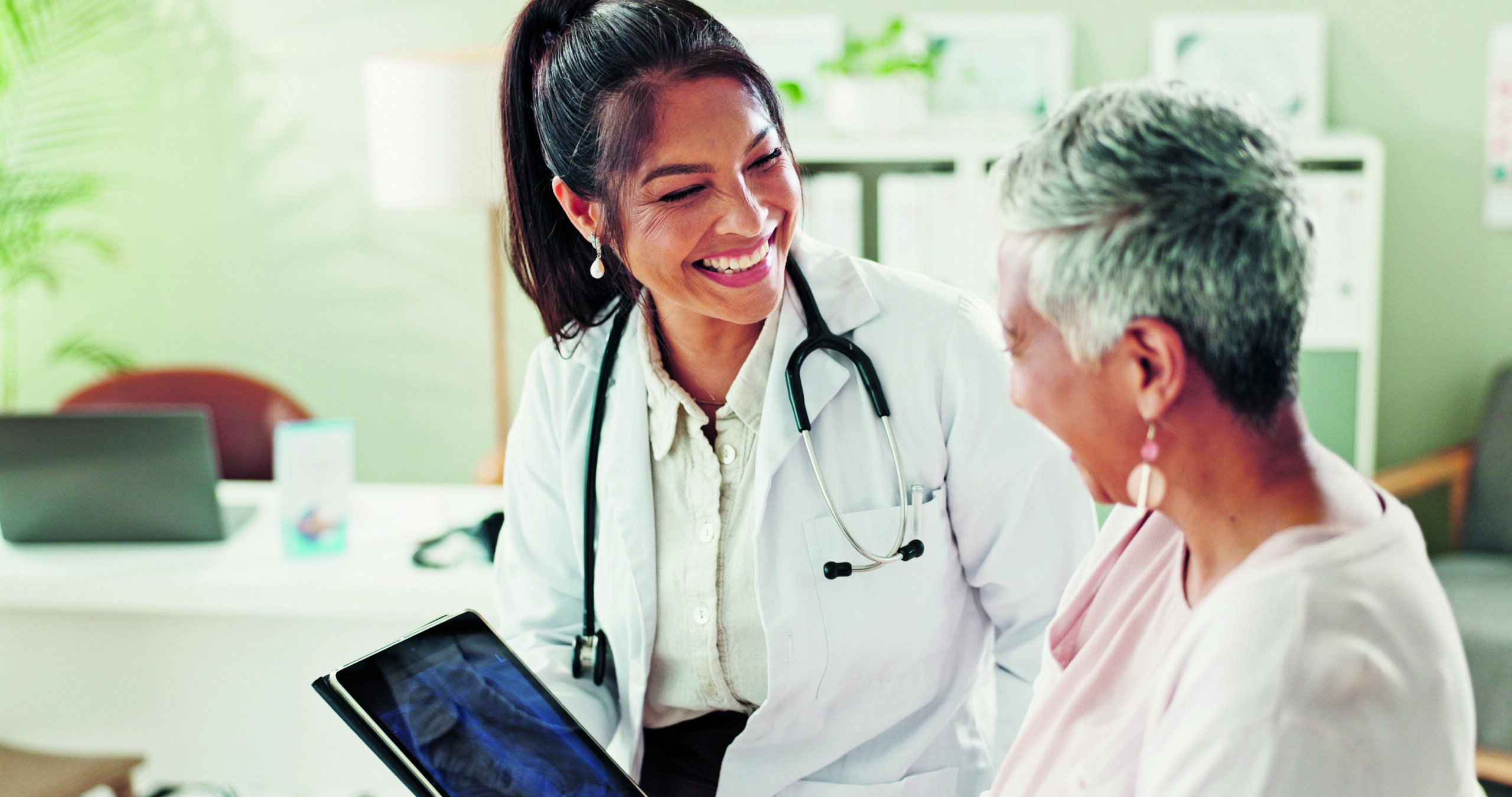 Mature,Woman,,Doctor,And,Tablet,For,Xray,,Support,Or,Conversation