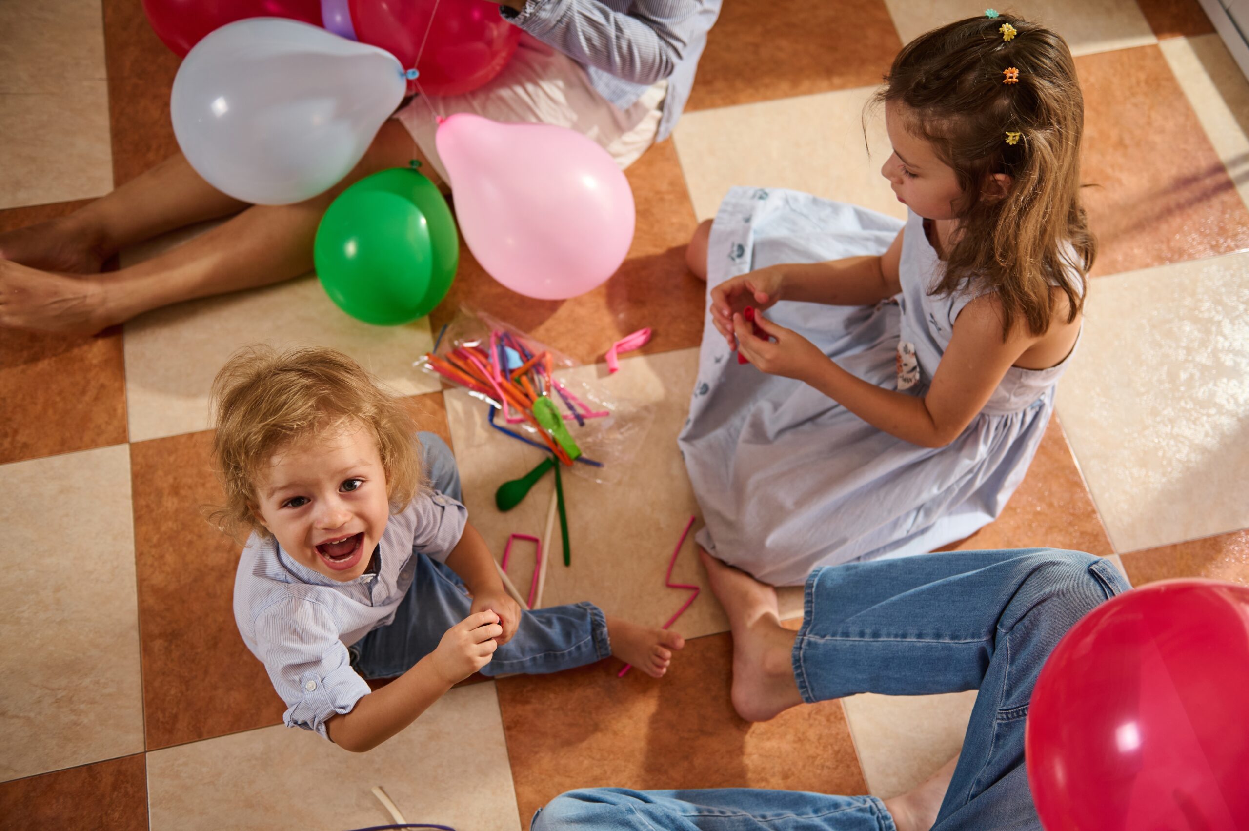 A,Joyful,Indoor,Gathering,Featuring,Children,Playing,With,Colorful,Balloons.